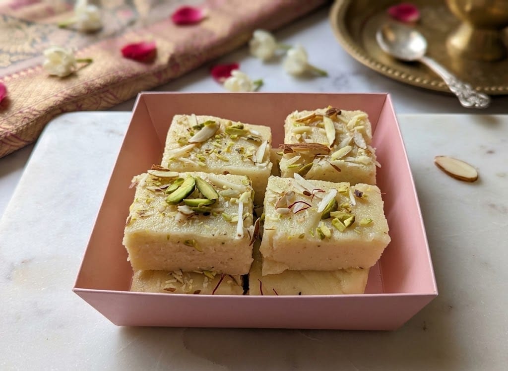 Mawa burfi squares topped with pistachios and almonds